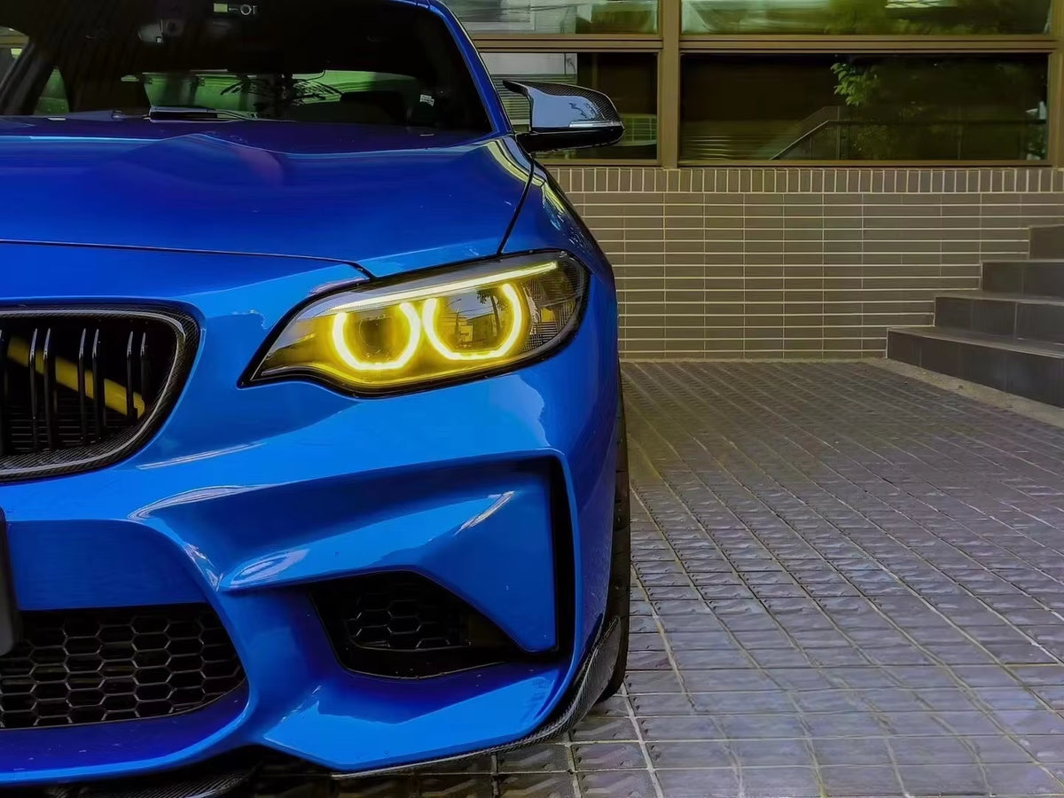 Yellow DRL angel eyes, front three-quarter view