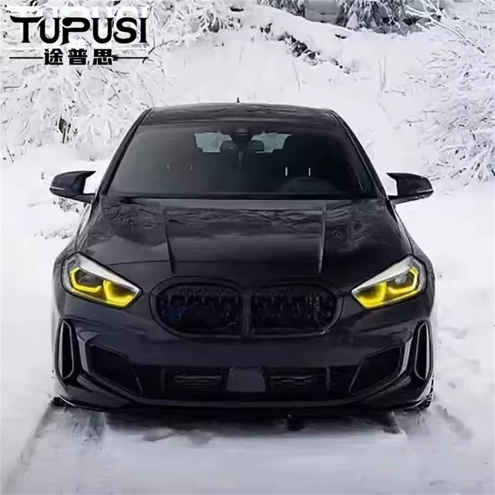 Yellow DRLs on a black BMW F40 1 Series in the snow
